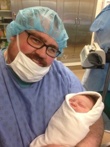 Erik gest to hold Oscar first.